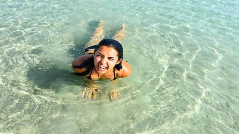 Woman Having Fun in Kalo Livadi Beach in Mykonos