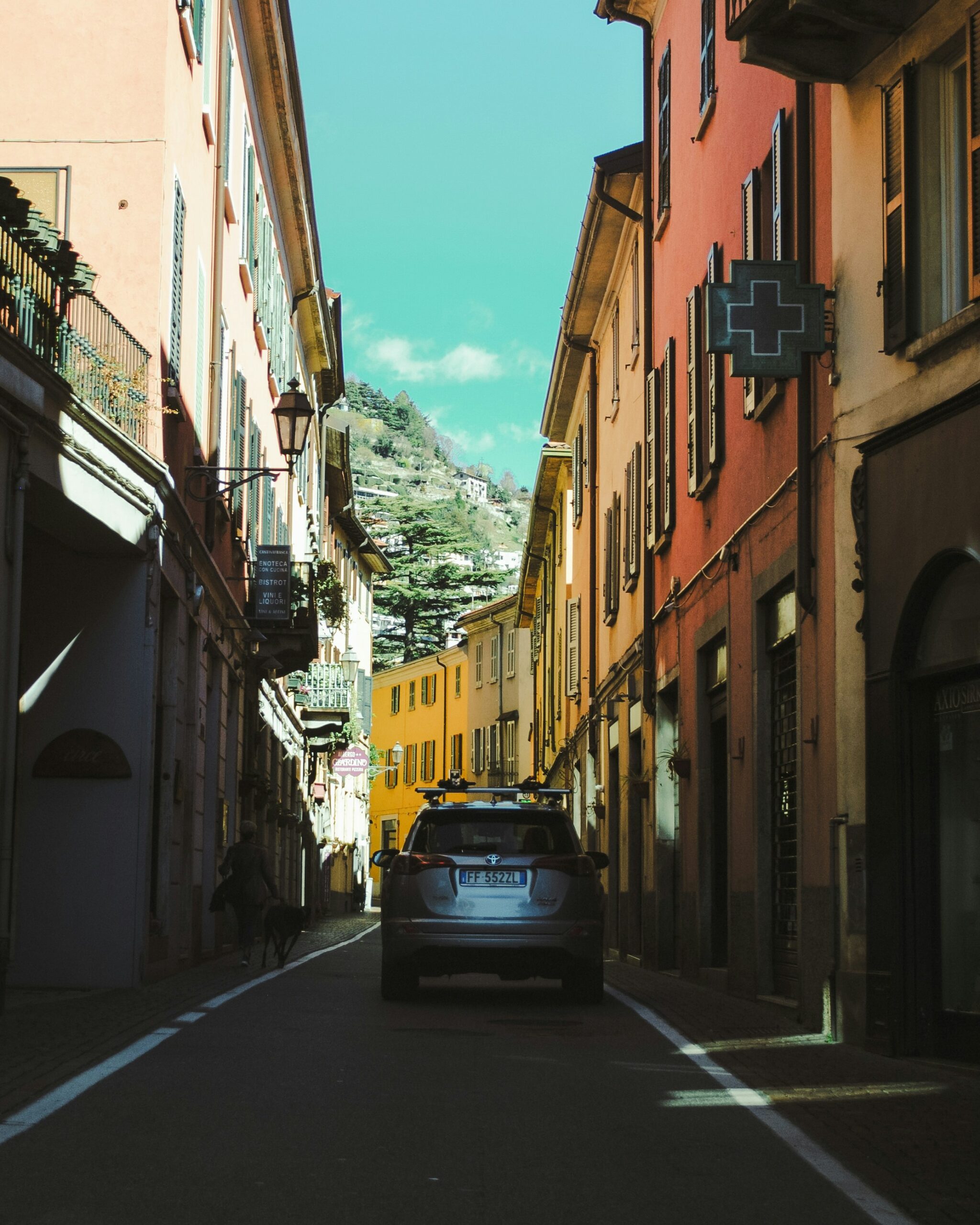 A car driving down a street in Tuscany