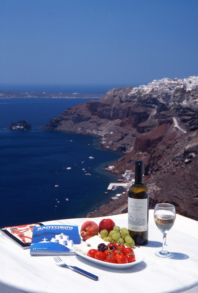 having dinner in santorini with beach views