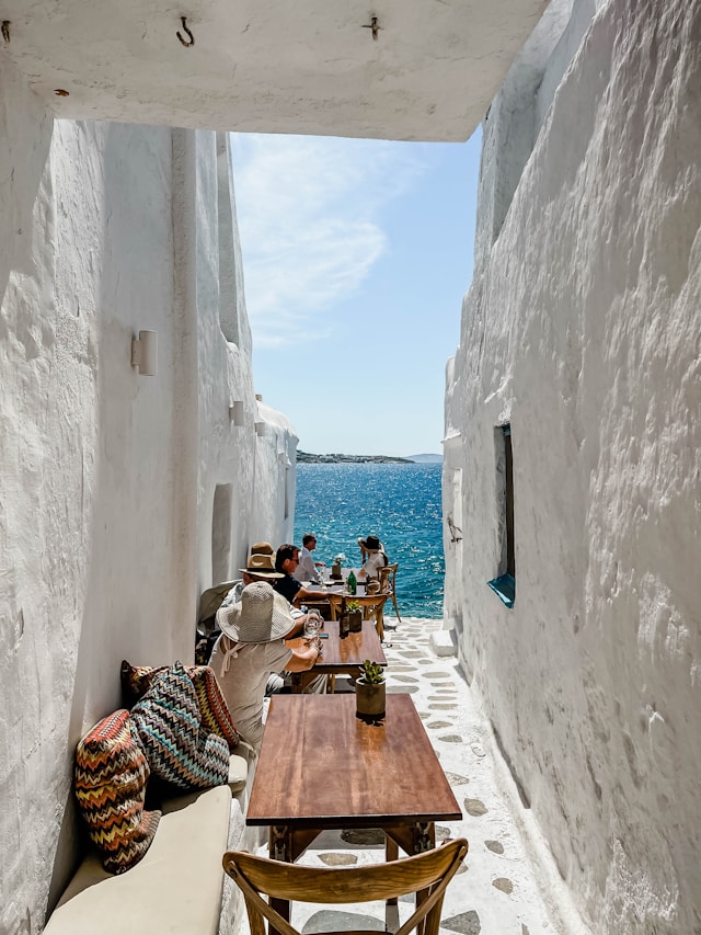 mykonos street with beach views for food lovers